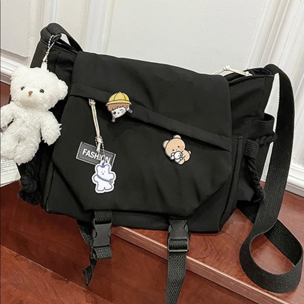 Black crossbody bag with accessories